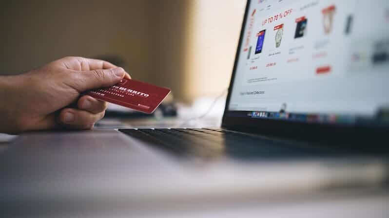 a laptop and a card used for ecommerce business online